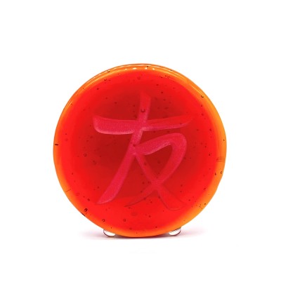 a red round glass disc with the Chinese character 'Friend, Friendship'.
