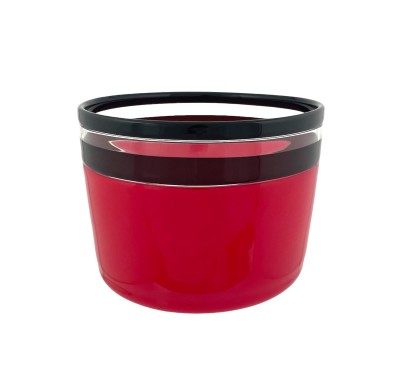 a hand blown glass vessel with a deep cherry-hued base and accentuated with a black and clear glass band at the top edge.