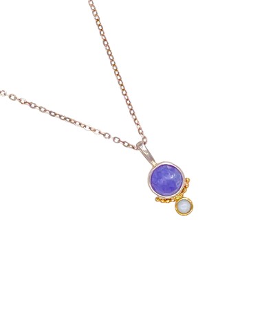 a pendant with a lavender-hued, faceted tanzanite stone is bezel set in Sterling. Accentuated with a series of 14k gold beads and an opal bezel set in gold.