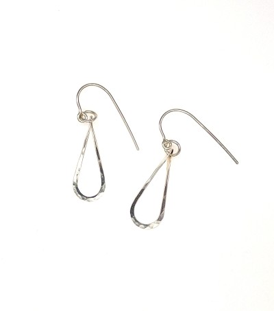 a handcrafted pair of Sterling silver tear drop shaped earrings with a subtle hammered surface.