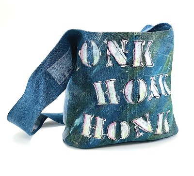 a blue jean fabric shoulder bag with stenciled painted letters, honk, honk, beep, beep.