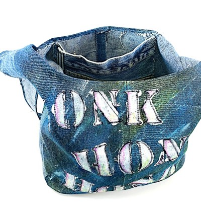 a blue jean fabric shoulder bag with stenciled painted letters, honk, honk, beep, beep.
