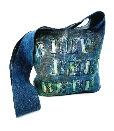 a blue jean fabric shoulder bag with stenciled painted letters, honk, honk, beep, beep.