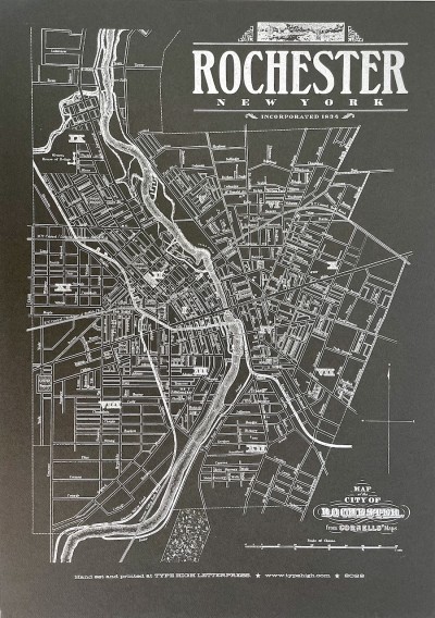 a letterpress print on black paper with white ink of a map of Rochester, NY in 1872