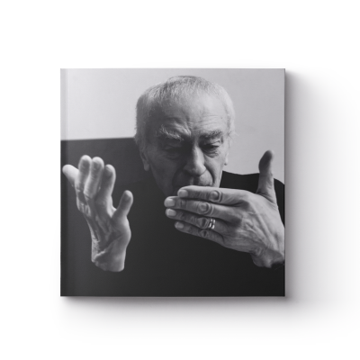 a book cover featuring a black and white portrait of Massimo Vignelli and the title 'Vignelli: Photographs by Gary Hustwit'