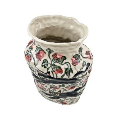 Top view of hand-formed porcelain vase painted with black cats and strawberries