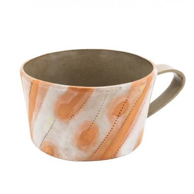 stoneware mug with bold orange stripes accented with cheerful yellow dots