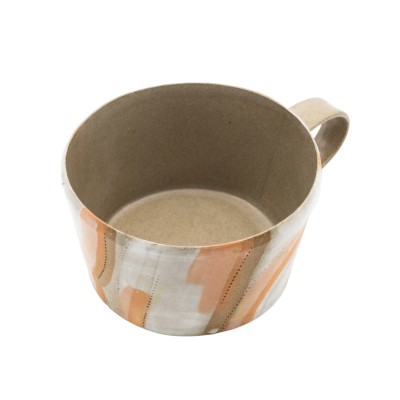 stoneware mug with luminous orange tones