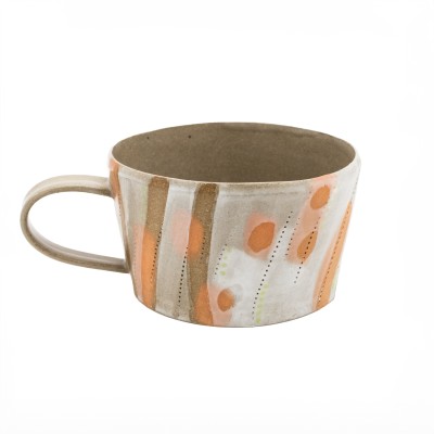 stoneware mug with luminous orange tones