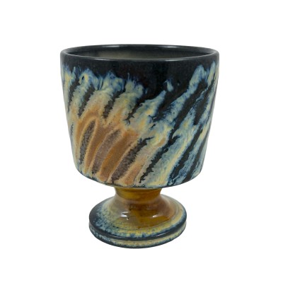 a hand-thrown stemware cup with bright blue and tan stripes
