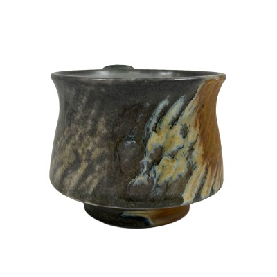 detailed view of a short mug with orange and dark grey details