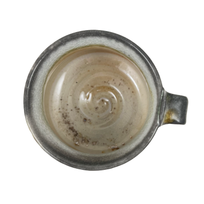 top view of a dark grey rimmed mug with handle, and light colored interior