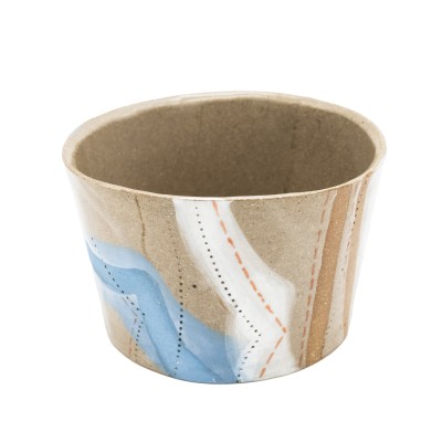 handcrafted stoneware mug featuring organic, flowing lines of blue, orange, and white