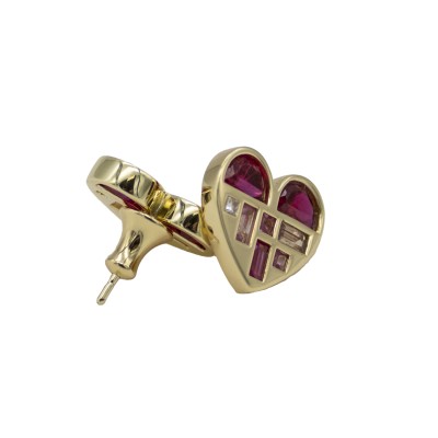 A graphic heart silhouette filled with mixed-cut gemstones arranged in a structured, painterly layout.