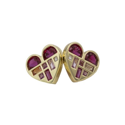 A graphic heart silhouette filled with mixed-cut gemstones arranged in a structured, painterly layout.