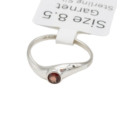a sterling silver mini twist ring with a garnet gemstone