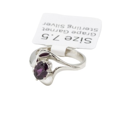 a sterling silver ring with a grape garnet gemstone