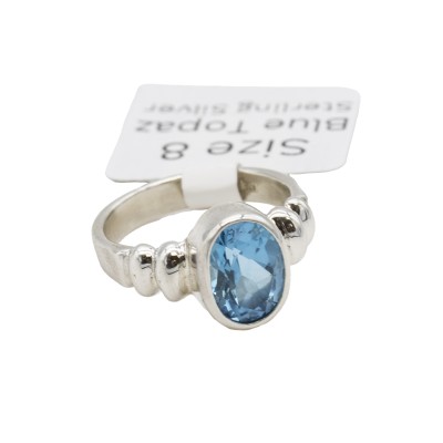 a sterling silver blue topaz ring with a bubble bezel