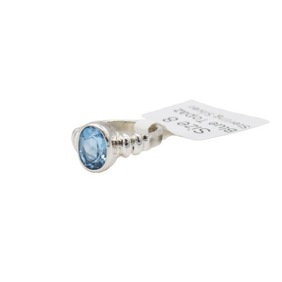 a sterling silver blue topaz ring with a bubble bezel
