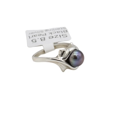 a sterling silver ring with a black pearl and formal references to cats