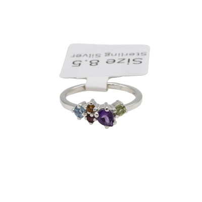 a sterling silver cluster ring with a variety of colored gemstones