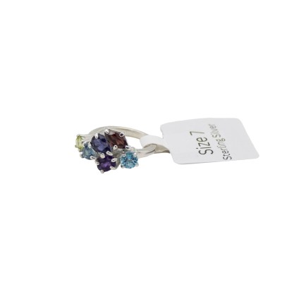 a sterling silver cluster ring with a variety of colored gemstones