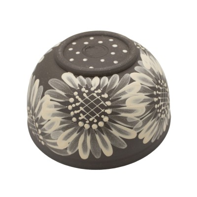a ceramic bowl with painted sunflowers