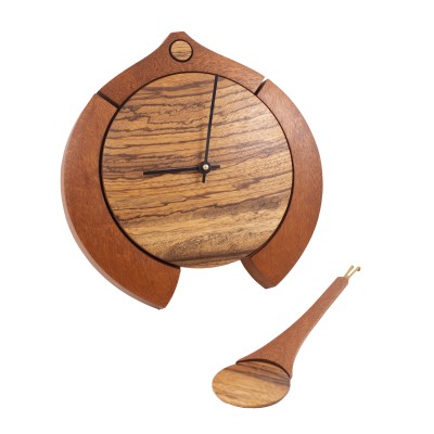 a beautiful pendulum clock made of mahogany and zebra wood