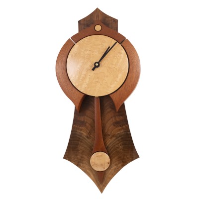 a stunning walnut, mahogany, and birdseye clock