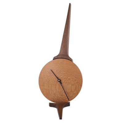a gorgeous northstar shaped clock made of walnut wood and australian lacewood