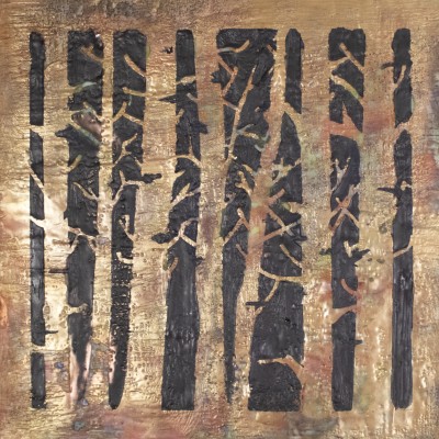 a piece reminiscent of trees painted in bronze