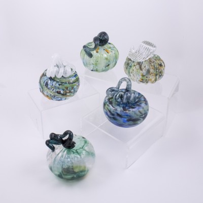 a variety of swirled blues, and greens, with some pops of orange and brown