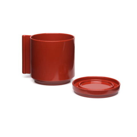 a single red cup and saucer.