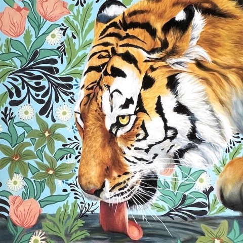 an illustration of a tiger head lapping at a pool of water surrounded by detailed and decorative images of pink flowers and green leaves.