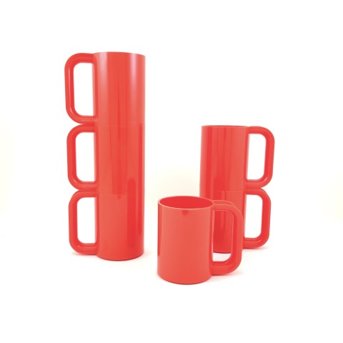 a set of six stackable orange plastic mugs with handles.