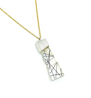 string suspended in a trapezoidal resin  Pendant with a Sterling silver cap on a gold filled chain.