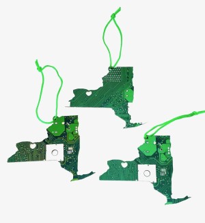 Three green Ornaments made of circuit board cut into the shape of New York State With a Heart where Rochester is located.