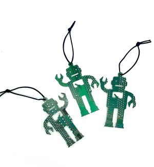 Three green robots made of circuit board with one arm up and a rectangle cut from the chest hung on a black string. 