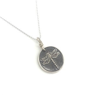Sterling Silver round Pendant with a dragonfly on it.