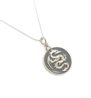 Sterling Silver round Pendant with a dragon on it.