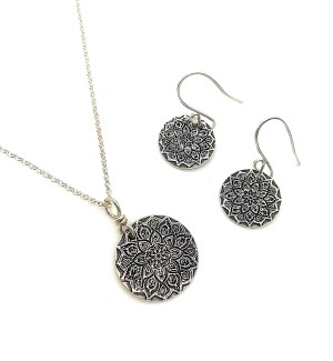 Sterling Silver Pendant and Earring Set with a Mandala pattern impression on it.