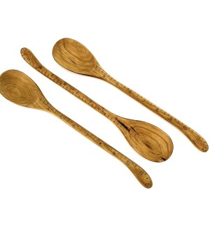 Three wooden spoons with a decorative ruler etched on them indicating that the spoon is 1ft long.