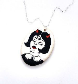 hand illustrated Ceramic necklace featuring a stylized girl with red devil horns and a third eye.