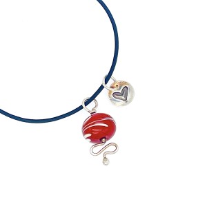 red glass bead on Sterling Silver wavy wire and heart stamped pendant.