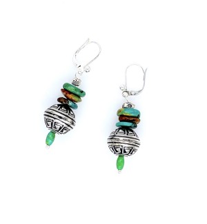 dangling earrings made of colorful flat beads as well as a larger silver ornamental bead atop a small green bead.