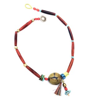 a necklace made with a colorful assortment of different shaped beads and a variegated stone-like pendant and dangling beads.