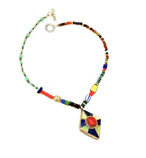 a necklace made with a colorful assortment of different shaped beads and a diamond shaped pendant with a red stone.