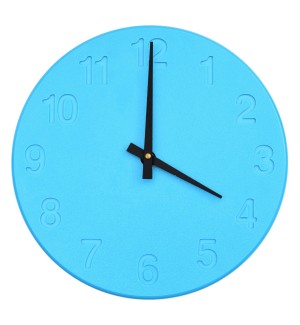 blue Wall Clock with black clock hands and numbers debossed into clock face.