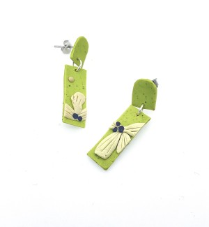 hand sculpted polymer clay dangle Earrings that are lime green with flowers on them.