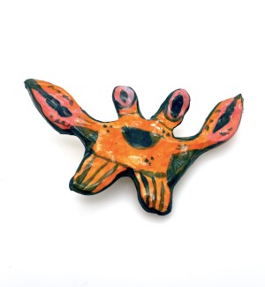Ceramic hand painted cartoonish crab pin.